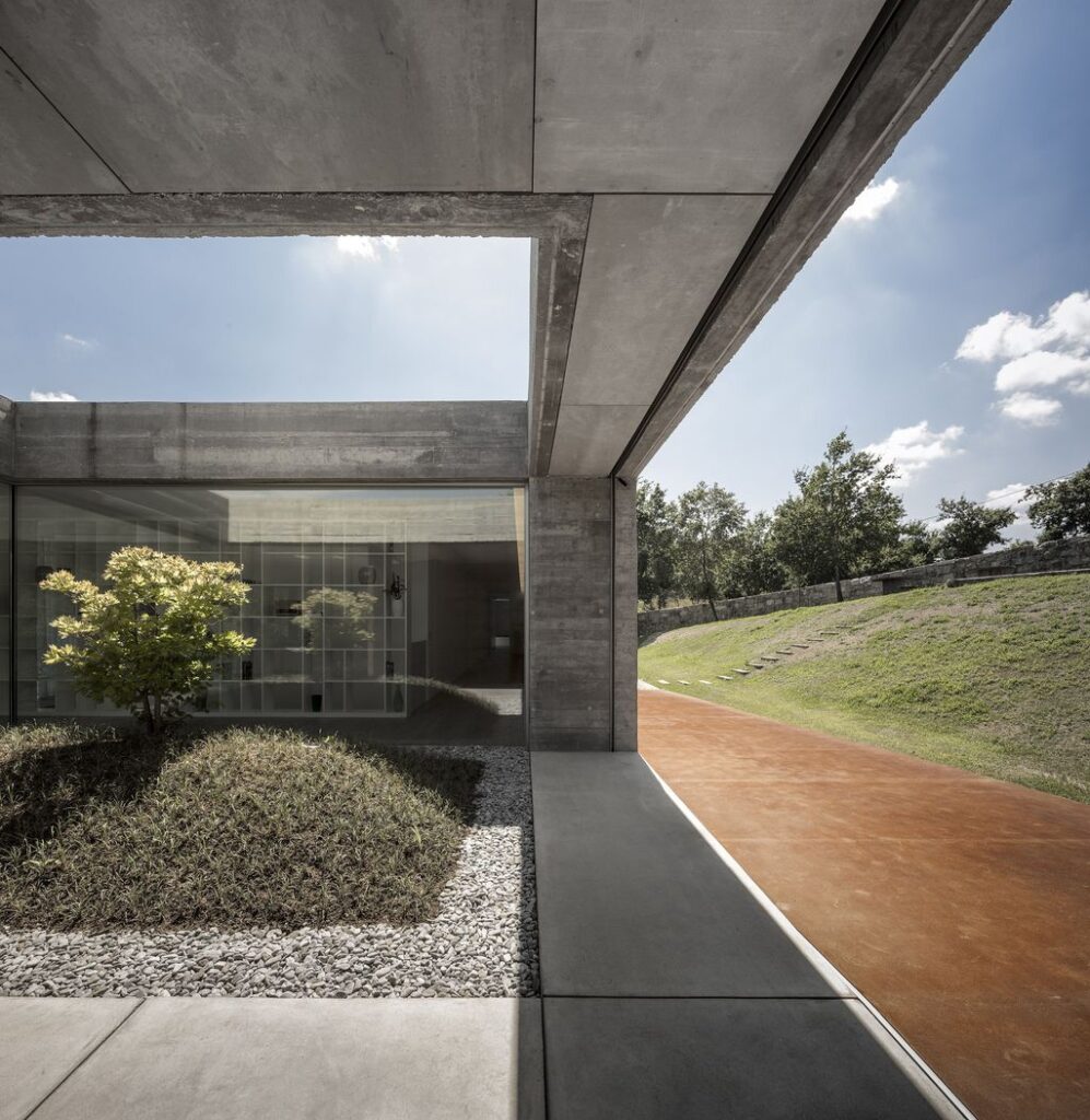 Long textured Sambade House in Portugal Countryside by Spaceworkers