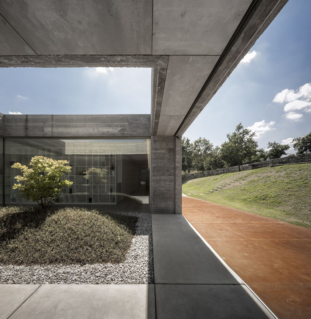 Long textured Sambade House in Portugal Countryside by Spaceworkers
