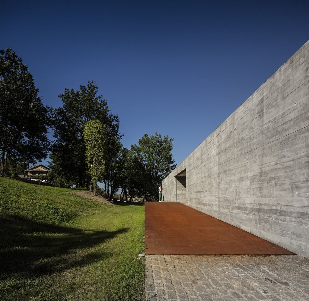 Long textured Sambade House in Portugal Countryside by Spaceworkers