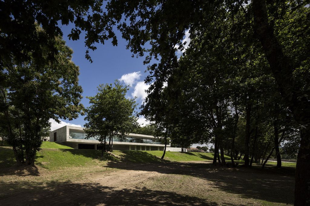 Long textured Sambade House in Portugal Countryside by Spaceworkers
