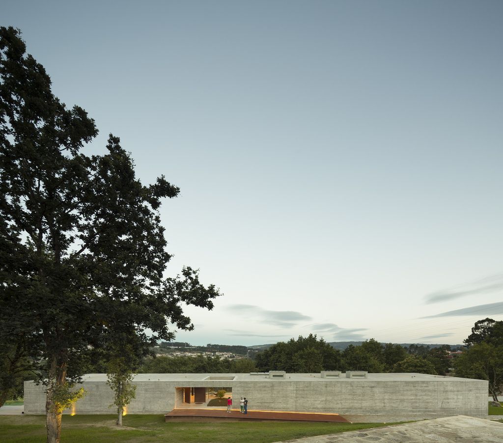 Long textured Sambade House in Portugal Countryside by Spaceworkers