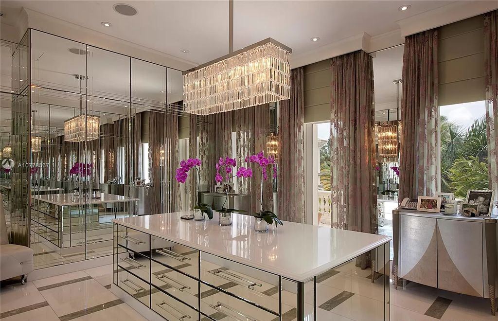 The Florida Mansion is a palatial estate is designed like no other with Absolutely unparalleled in finishes, appointments now available for sale. This home located at 182 Bal Bay Dr, Bal Harbour, Florida; offering 8 bedrooms and 11 bathrooms with over 12,000 square feet of living spaces.
