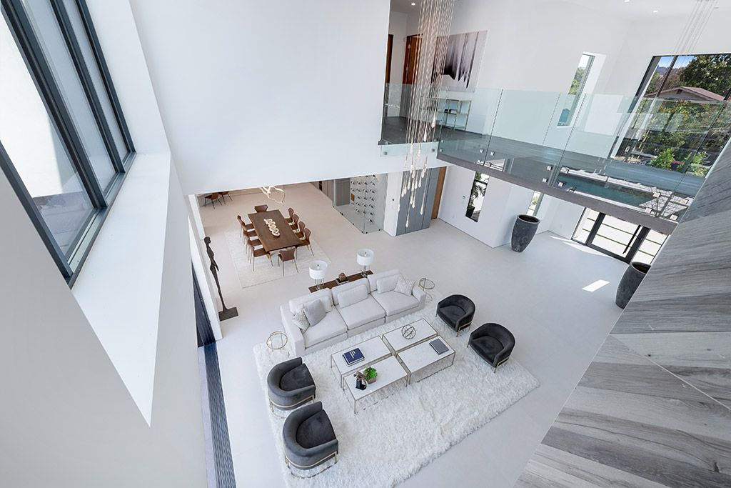 This Studio City Homes, an Architectural Tour De Force was executed and designed by the famed Arzuman Brothers. Situated at the ultimate privacy surrounding green trees and bushed, the over 6,500 sqft luxury home was built in 2018
