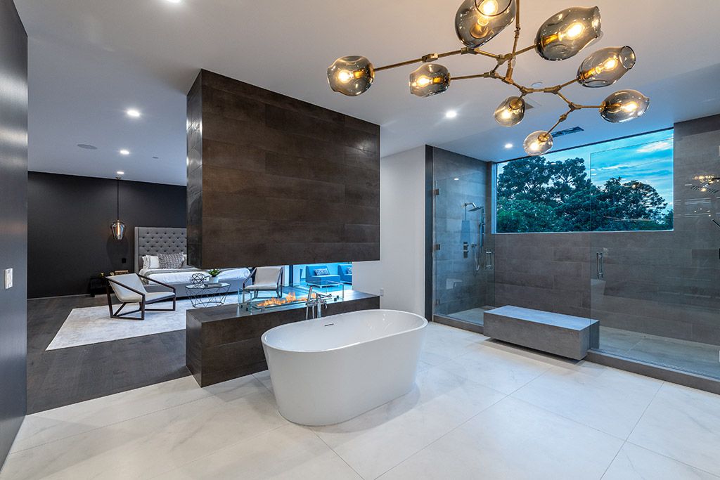 This Studio City Homes, an Architectural Tour De Force was executed and designed by the famed Arzuman Brothers. Situated at the ultimate privacy surrounding green trees and bushed, the over 6,500 sqft luxury home was built in 2018