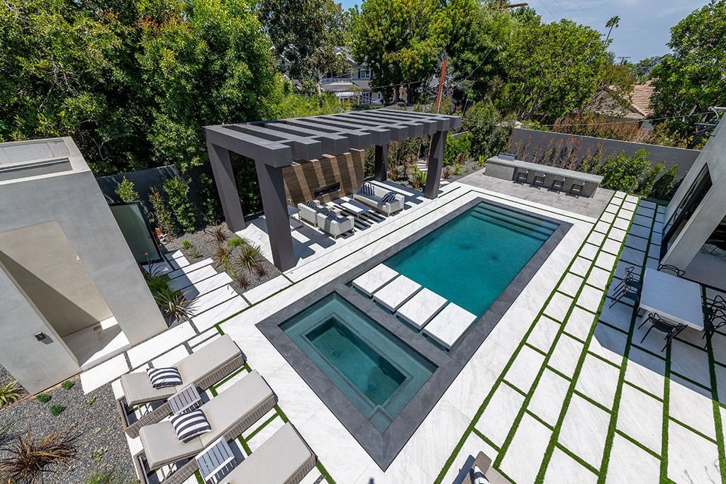 This Studio City Homes, an Architectural Tour De Force was executed and designed by the famed Arzuman Brothers. Situated at the ultimate privacy surrounding green trees and bushed, the over 6,500 sqft luxury home was built in 2018
