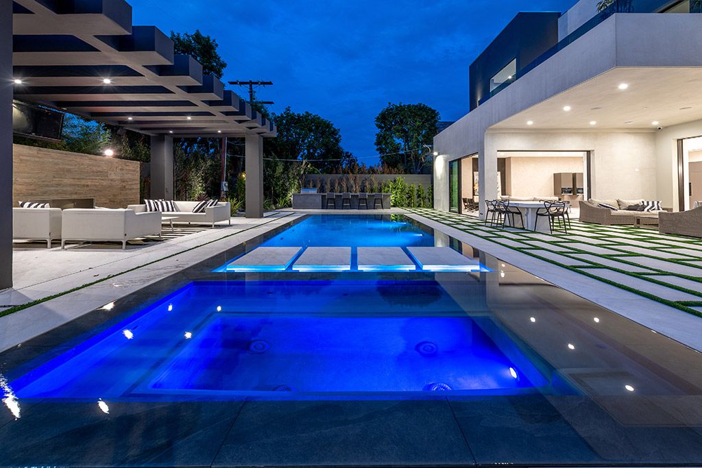 This Studio City Homes, an Architectural Tour De Force was executed and designed by the famed Arzuman Brothers. Situated at the ultimate privacy surrounding green trees and bushed, the over 6,500 sqft luxury home was built in 2018