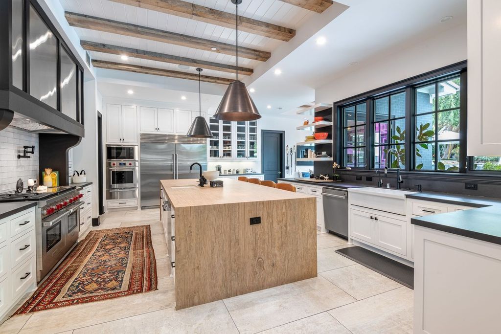 The Encino Home is a sophisticated property in the prestigious Royal Oaks community with a palatial layout provides comfortable space now available for sale. This home located at 16133 High Valley Pl, Encino, California; offering 7 bedrooms and 10 bathrooms with over 8,500 square feet of living spaces.
