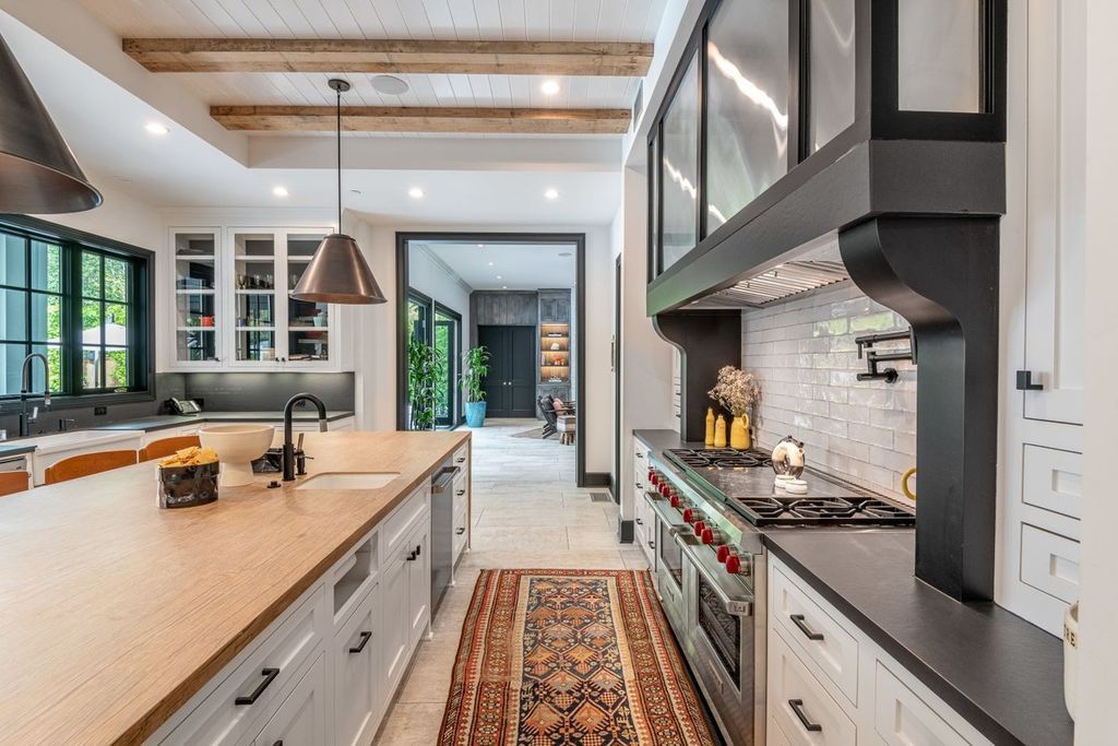 The Encino Home is a sophisticated property in the prestigious Royal Oaks community with a palatial layout provides comfortable space now available for sale. This home located at 16133 High Valley Pl, Encino, California; offering 7 bedrooms and 10 bathrooms with over 8,500 square feet of living spaces.