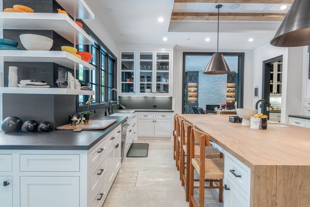The Encino Home is a sophisticated property in the prestigious Royal Oaks community with a palatial layout provides comfortable space now available for sale. This home located at 16133 High Valley Pl, Encino, California; offering 7 bedrooms and 10 bathrooms with over 8,500 square feet of living spaces.