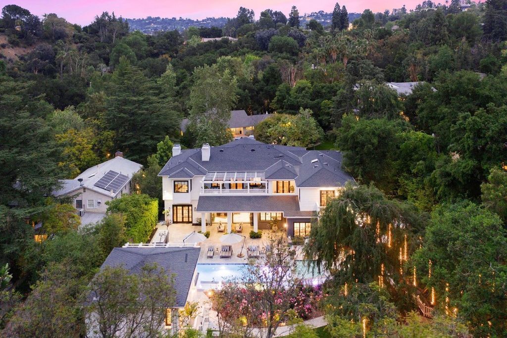 The Encino Home is a sophisticated property in the prestigious Royal Oaks community with a palatial layout provides comfortable space now available for sale. This home located at 16133 High Valley Pl, Encino, California; offering 7 bedrooms and 10 bathrooms with over 8,500 square feet of living spaces.