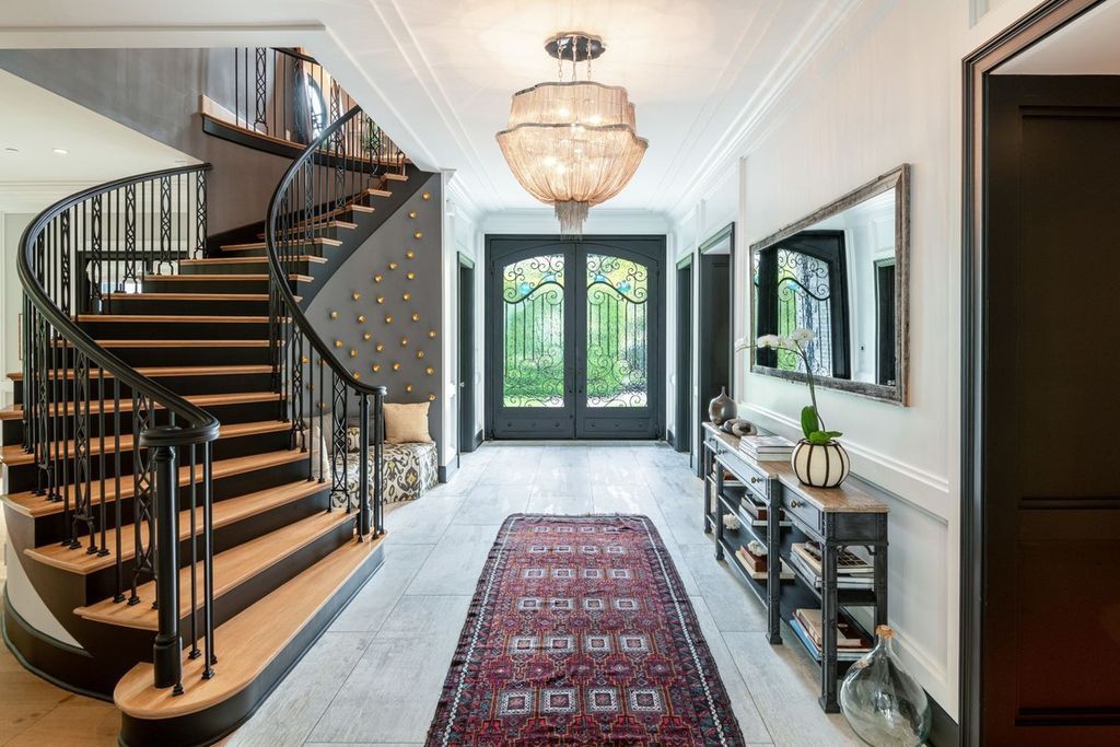 The Encino Home is a sophisticated property in the prestigious Royal Oaks community with a palatial layout provides comfortable space now available for sale. This home located at 16133 High Valley Pl, Encino, California; offering 7 bedrooms and 10 bathrooms with over 8,500 square feet of living spaces.