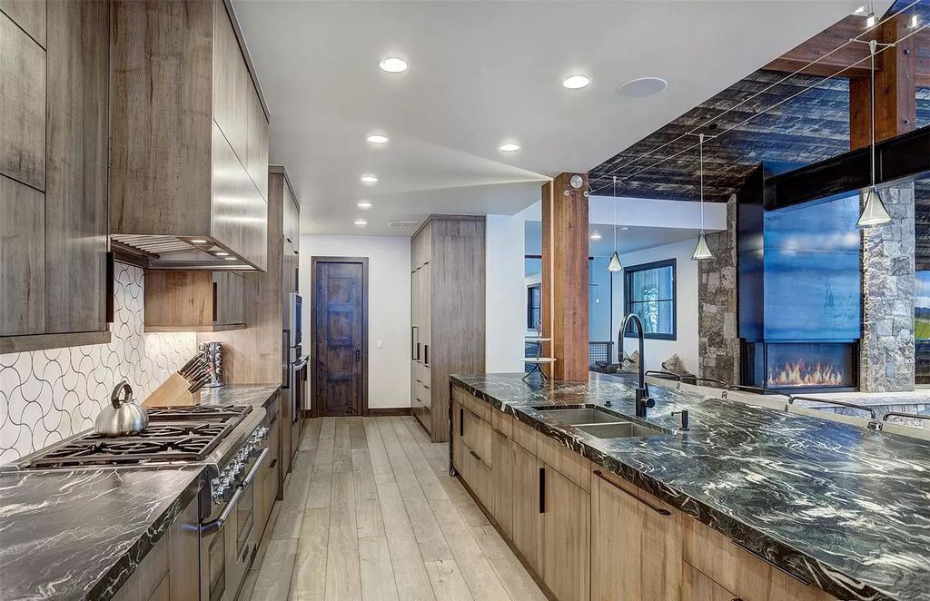 The Colorado Mountain Home is a true custom ski home with total privacy and heated back patio made for entertaining now available for sale. This home located at 460 Timber Trail Rd, Breckenridge, Colorado