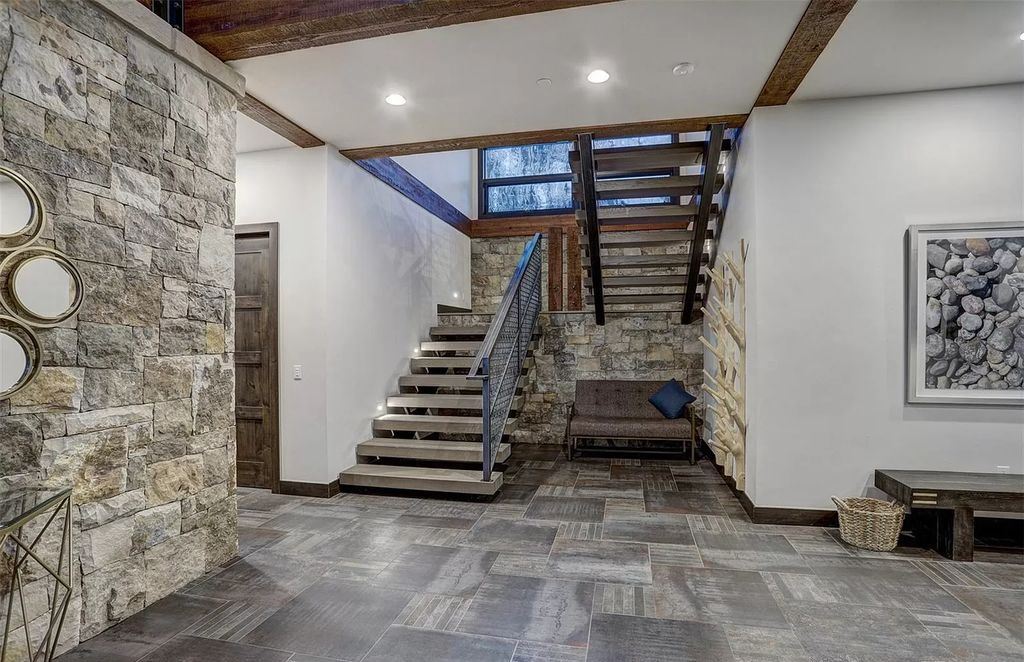 The Colorado Mountain Home is a true custom ski home with total privacy and heated back patio made for entertaining now available for sale. This home located at 460 Timber Trail Rd, Breckenridge, Colorado
