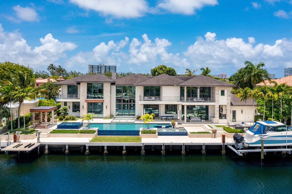 The Fort Lauderdale Home is a stunning estate nestled in the exclusive Bay Colony community perfect for entertaining now available for sale. This home located at 20 Compass Is, Fort Lauderdale, Florida