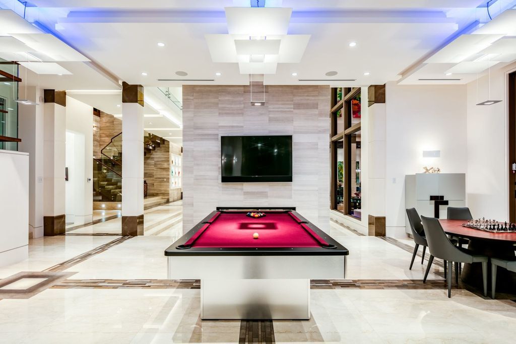The Fort Lauderdale Home is a stunning estate nestled in the exclusive Bay Colony community perfect for entertaining now available for sale. This home located at 20 Compass Is, Fort Lauderdale, Florida