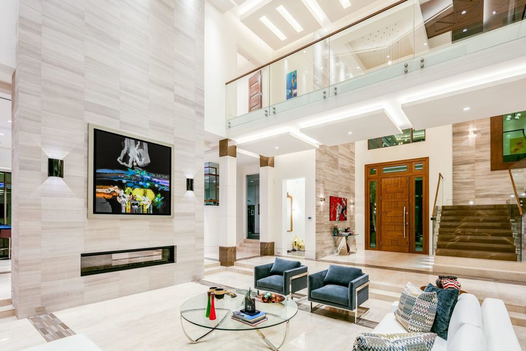 The Fort Lauderdale Home is a stunning estate nestled in the exclusive Bay Colony community perfect for entertaining now available for sale. This home located at 20 Compass Is, Fort Lauderdale, Florida