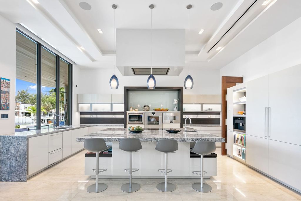 The Fort Lauderdale Home is a stunning estate nestled in the exclusive Bay Colony community perfect for entertaining now available for sale. This home located at 20 Compass Is, Fort Lauderdale, Florida
