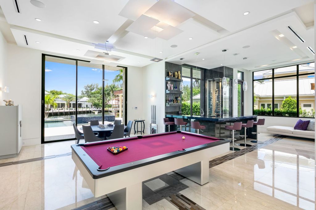 The Fort Lauderdale Home is a stunning estate nestled in the exclusive Bay Colony community perfect for entertaining now available for sale. This home located at 20 Compass Is, Fort Lauderdale, Florida