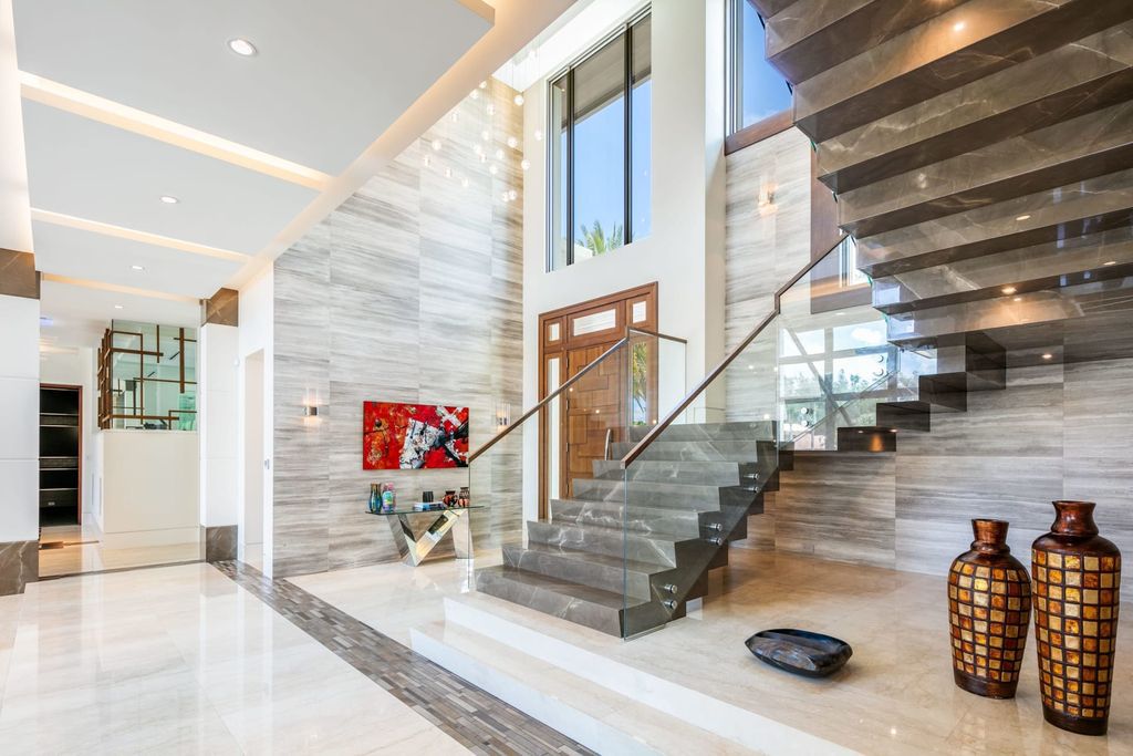 The Fort Lauderdale Home is a stunning estate nestled in the exclusive Bay Colony community perfect for entertaining now available for sale. This home located at 20 Compass Is, Fort Lauderdale, Florida