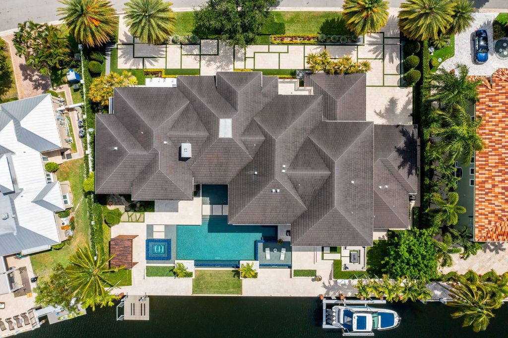 The Fort Lauderdale Home is a stunning estate nestled in the exclusive Bay Colony community perfect for entertaining now available for sale. This home located at 20 Compass Is, Fort Lauderdale, Florida