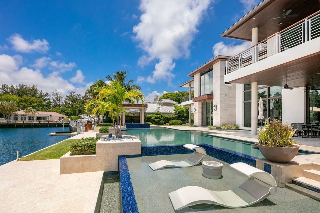 The Fort Lauderdale Home is a stunning estate nestled in the exclusive Bay Colony community perfect for entertaining now available for sale. This home located at 20 Compass Is, Fort Lauderdale, Florida