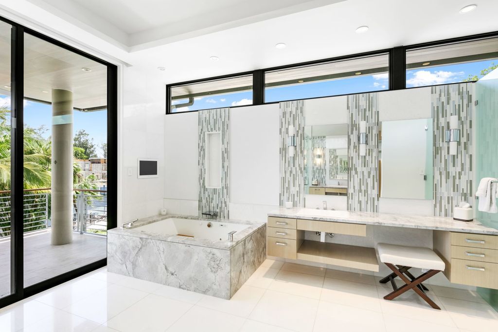 The Fort Lauderdale Home is a stunning estate nestled in the exclusive Bay Colony community perfect for entertaining now available for sale. This home located at 20 Compass Is, Fort Lauderdale, Florida