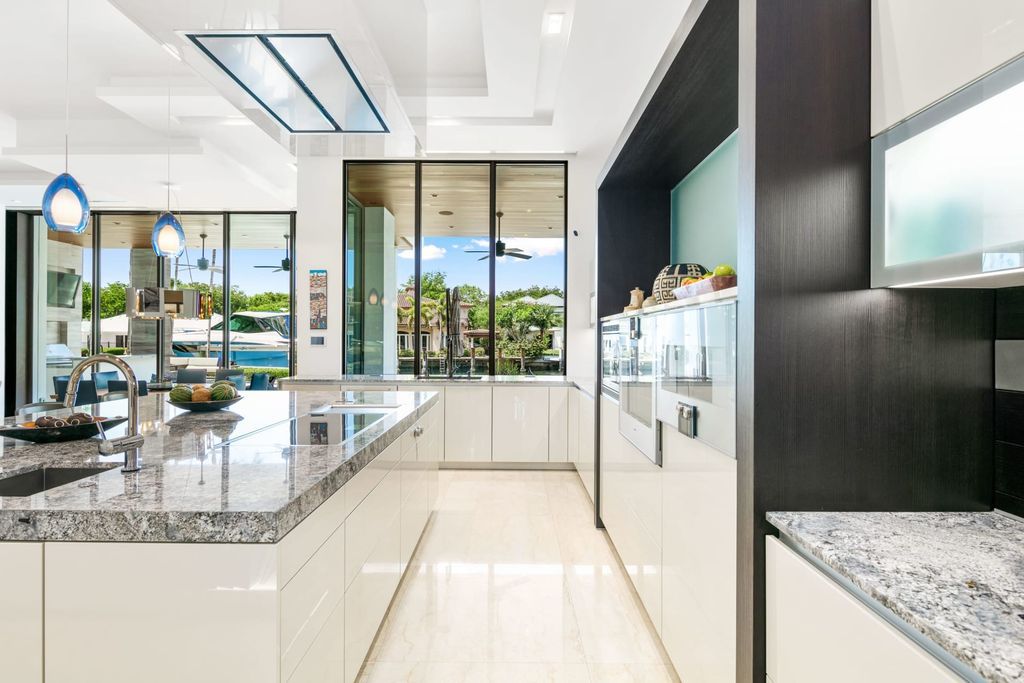 The Fort Lauderdale Home is a stunning estate nestled in the exclusive Bay Colony community perfect for entertaining now available for sale. This home located at 20 Compass Is, Fort Lauderdale, Florida