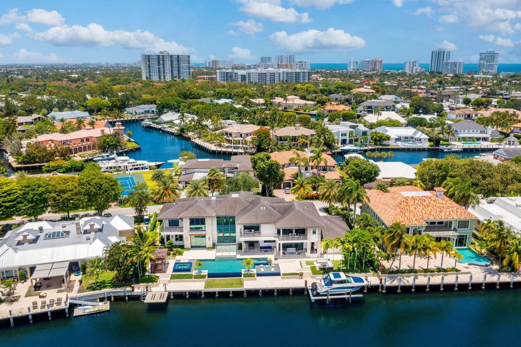 The Fort Lauderdale Home is a stunning estate nestled in the exclusive Bay Colony community perfect for entertaining now available for sale. This home located at 20 Compass Is, Fort Lauderdale, Florida