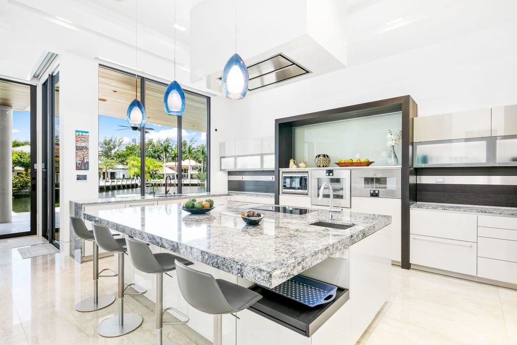 The Fort Lauderdale Home is a stunning estate nestled in the exclusive Bay Colony community perfect for entertaining now available for sale. This home located at 20 Compass Is, Fort Lauderdale, Florida