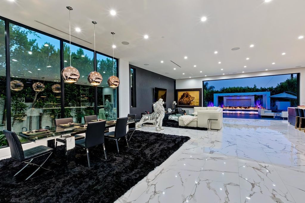 The Resort-like Home in Los Angeles is a sophisticated, high end property in Beverlywood featuring an open floor plan with unobstructed indoor-outdoor flow now available for sale. This home located at 9704 Cashio St, Los Angeles, California