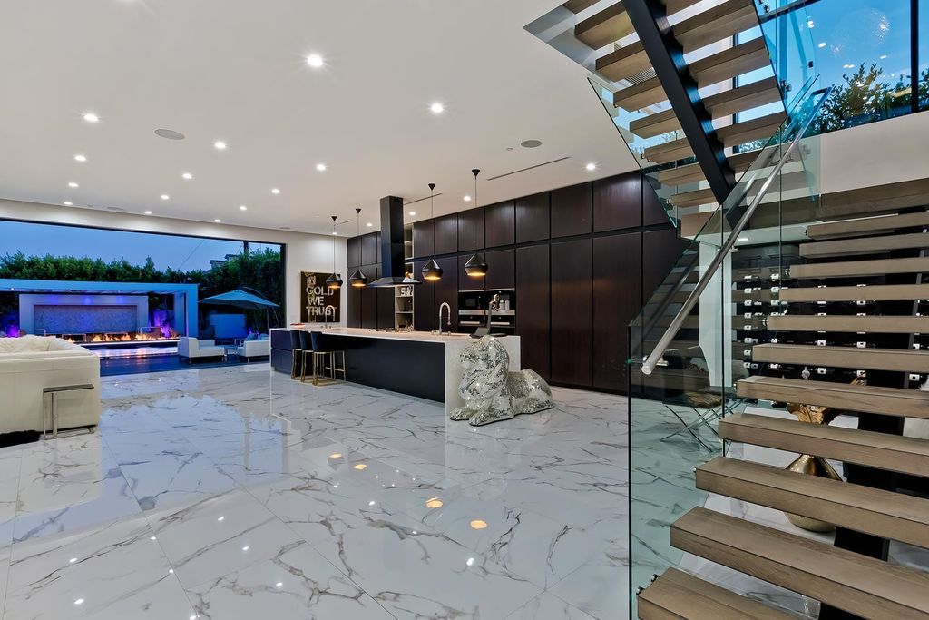 The Resort-like Home in Los Angeles is a sophisticated, high end property in Beverlywood featuring an open floor plan with unobstructed indoor-outdoor flow now available for sale. This home located at 9704 Cashio St, Los Angeles, California
