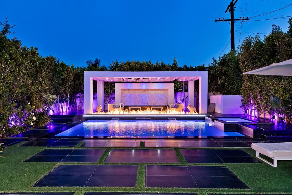 The Resort-like Home in Los Angeles is a sophisticated, high end property in Beverlywood featuring an open floor plan with unobstructed indoor-outdoor flow now available for sale. This home located at 9704 Cashio St, Los Angeles, California
