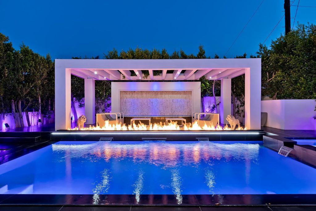 The Resort-like Home in Los Angeles is a sophisticated, high end property in Beverlywood featuring an open floor plan with unobstructed indoor-outdoor flow now available for sale. This home located at 9704 Cashio St, Los Angeles, California