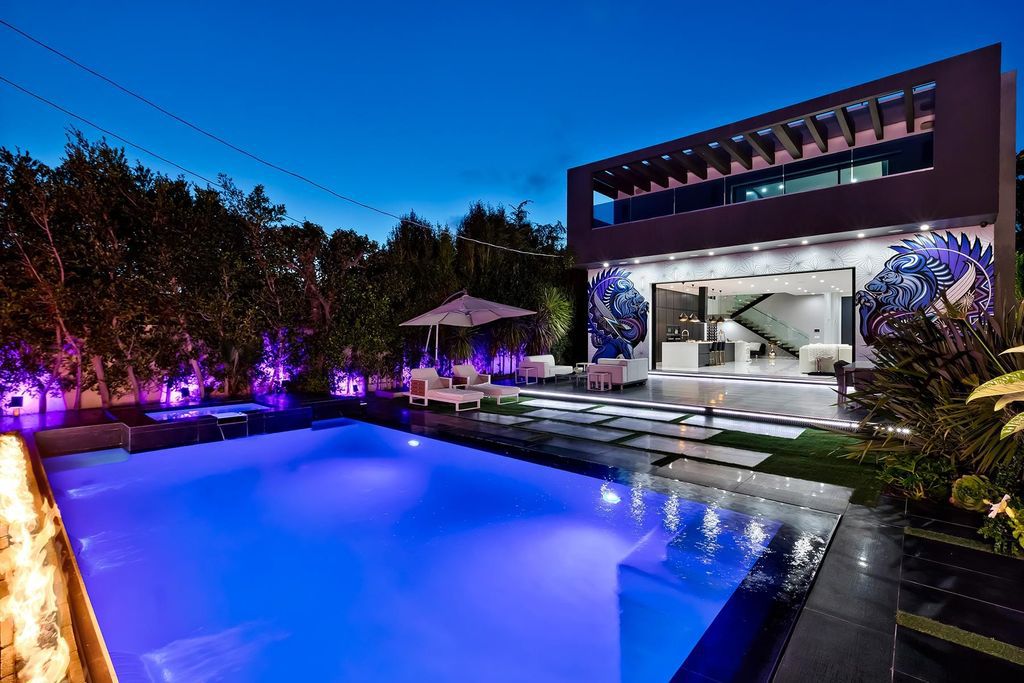The Resort-like Home in Los Angeles is a sophisticated, high end property in Beverlywood featuring an open floor plan with unobstructed indoor-outdoor flow now available for sale. This home located at 9704 Cashio St, Los Angeles, California