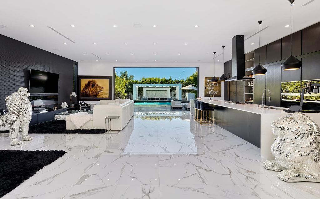 The Resort-like Home in Los Angeles is a sophisticated, high end property in Beverlywood featuring an open floor plan with unobstructed indoor-outdoor flow now available for sale. This home located at 9704 Cashio St, Los Angeles, California