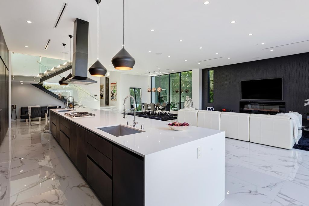 The Resort-like Home in Los Angeles is a sophisticated, high end property in Beverlywood featuring an open floor plan with unobstructed indoor-outdoor flow now available for sale. This home located at 9704 Cashio St, Los Angeles, California
