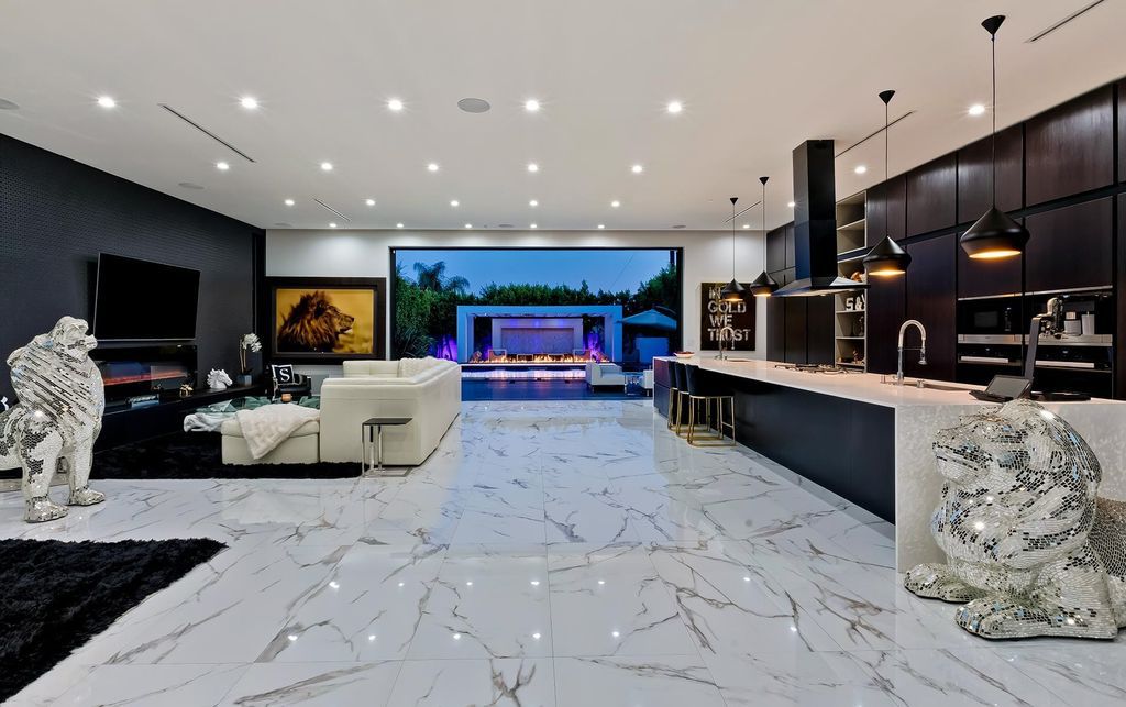 The Resort-like Home in Los Angeles is a sophisticated, high end property in Beverlywood featuring an open floor plan with unobstructed indoor-outdoor flow now available for sale. This home located at 9704 Cashio St, Los Angeles, California