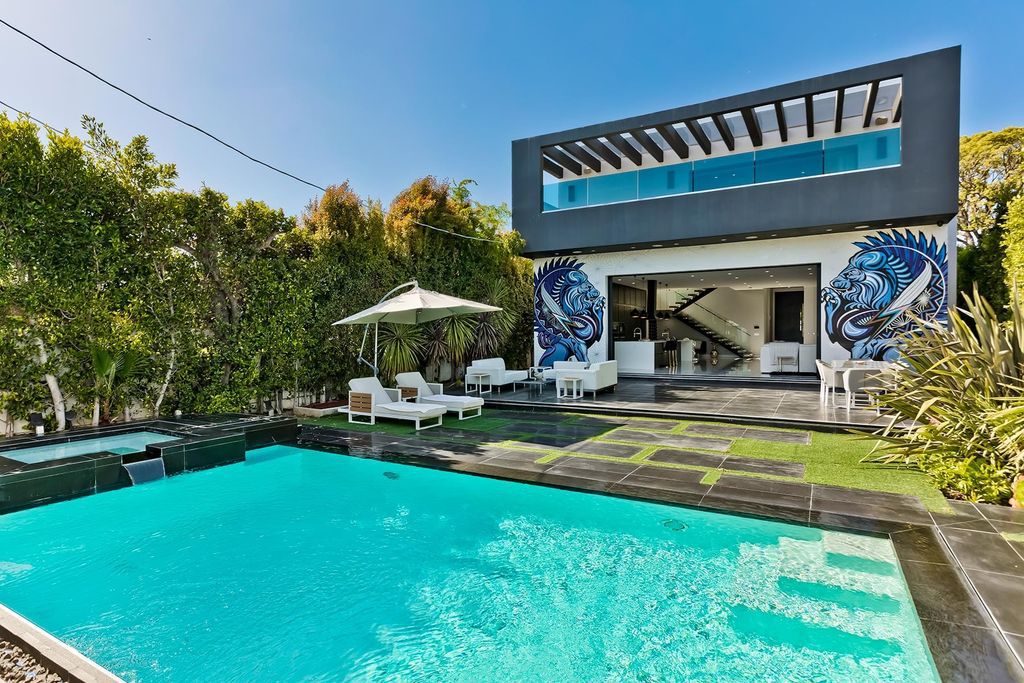 The Resort-like Home in Los Angeles is a sophisticated, high end property in Beverlywood featuring an open floor plan with unobstructed indoor-outdoor flow now available for sale. This home located at 9704 Cashio St, Los Angeles, California