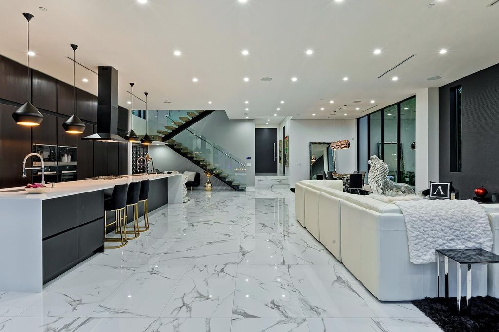 The Resort-like Home in Los Angeles is a sophisticated, high end property in Beverlywood featuring an open floor plan with unobstructed indoor-outdoor flow now available for sale. This home located at 9704 Cashio St, Los Angeles, California