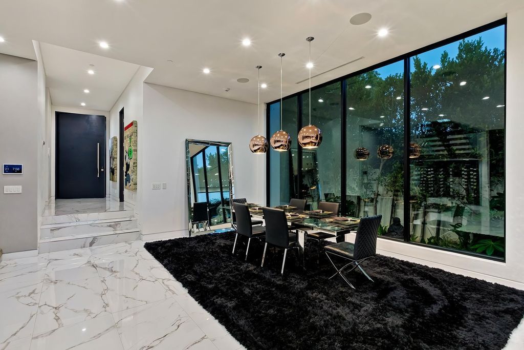 The Resort-like Home in Los Angeles is a sophisticated, high end property in Beverlywood featuring an open floor plan with unobstructed indoor-outdoor flow now available for sale. This home located at 9704 Cashio St, Los Angeles, California