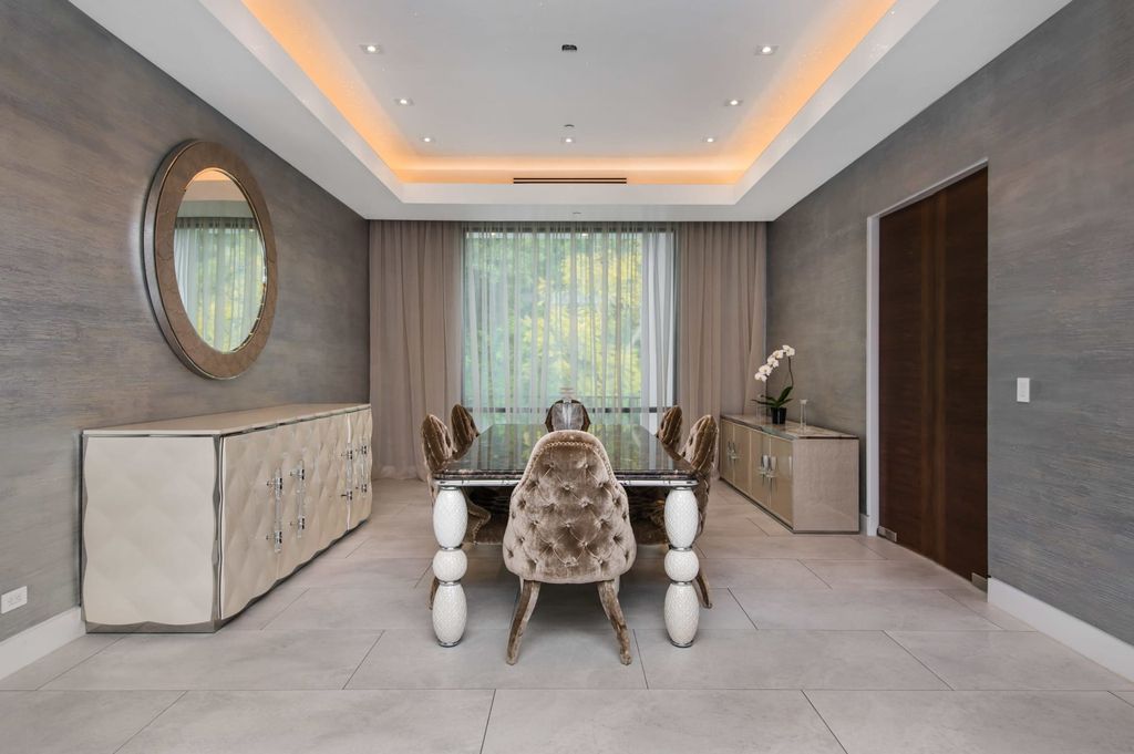 The Contemporary Home in Beverly Hills with panoramic views is built with soaring ceilings, clean lines, and sleek intricacies now available for sale. This home located at 1041 N Hillcrest Rd, Beverly Hills, California