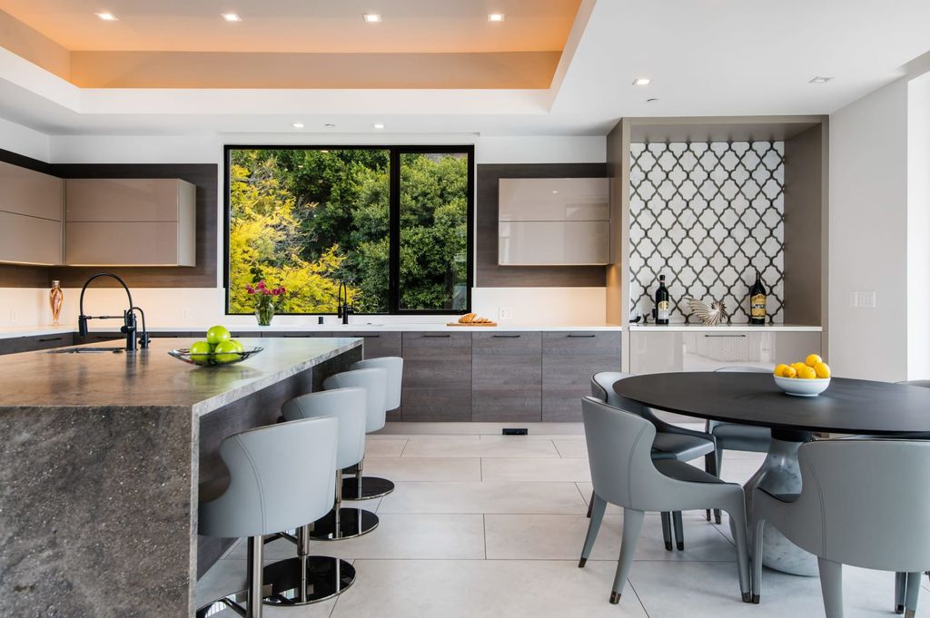 The Contemporary Home in Beverly Hills with panoramic views is built with soaring ceilings, clean lines, and sleek intricacies now available for sale. This home located at 1041 N Hillcrest Rd, Beverly Hills, California