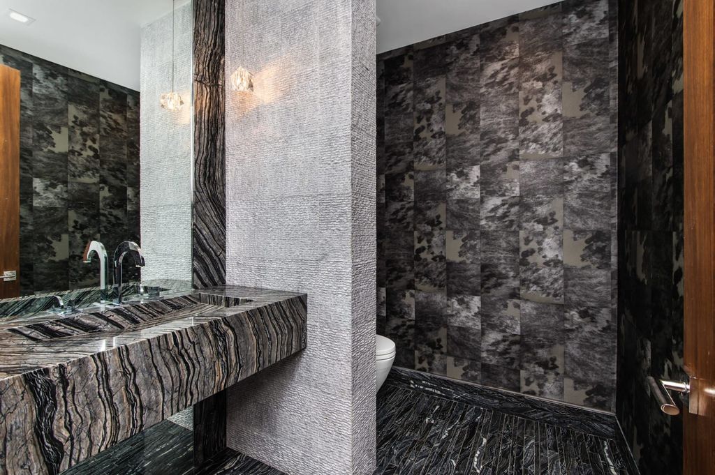 The Contemporary Home in Beverly Hills with panoramic views is built with soaring ceilings, clean lines, and sleek intricacies now available for sale. This home located at 1041 N Hillcrest Rd, Beverly Hills, California