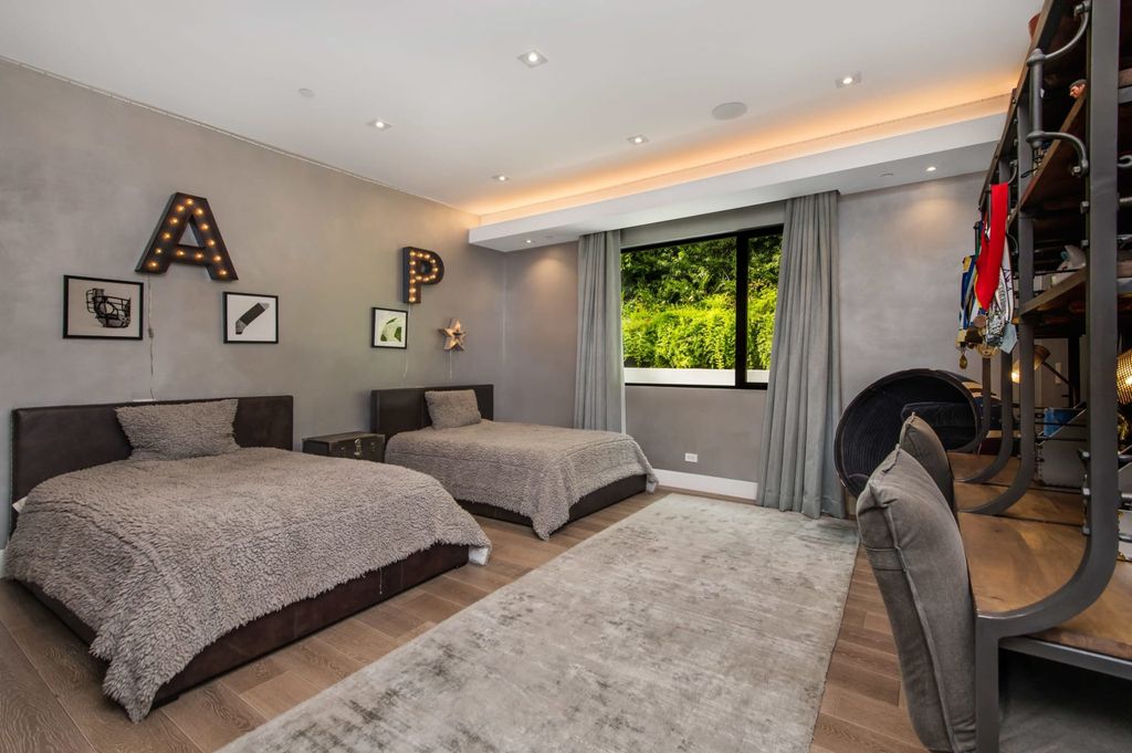 The Contemporary Home in Beverly Hills with panoramic views is built with soaring ceilings, clean lines, and sleek intricacies now available for sale. This home located at 1041 N Hillcrest Rd, Beverly Hills, California
