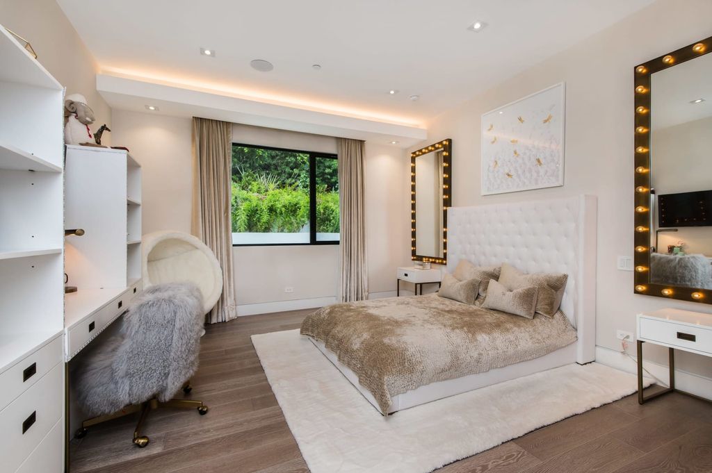 The Contemporary Home in Beverly Hills with panoramic views is built with soaring ceilings, clean lines, and sleek intricacies now available for sale. This home located at 1041 N Hillcrest Rd, Beverly Hills, California