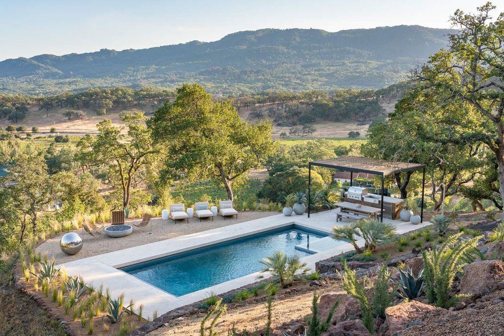 The Glen Ellen Modern Home is a 15-acre hillside Sonoma Valley property in a classic California setting with dramatic views now available for sale. This home located at 500 Aurora Ln, Glen Ellen, California