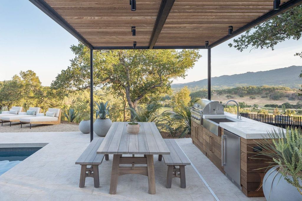 The Glen Ellen Modern Home is a 15-acre hillside Sonoma Valley property in a classic California setting with dramatic views now available for sale. This home located at 500 Aurora Ln, Glen Ellen, California