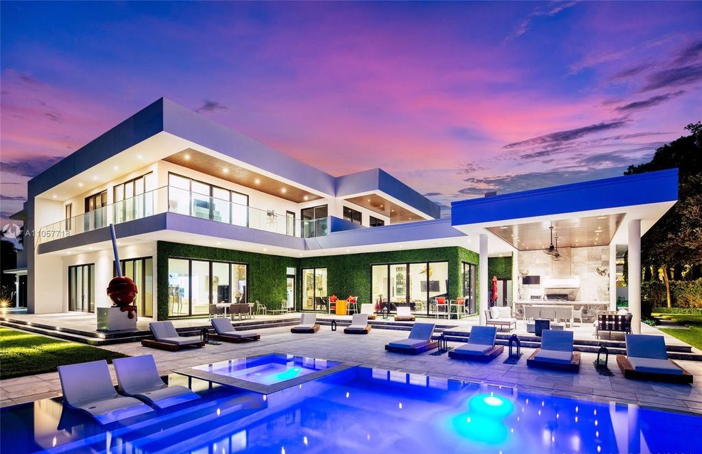 This Mansion in Golden Beach is a modern tropical oasis is situated on a wide canal with breathtaking water views available for sale. This home located at 660 N Island, Golden Beach, Florida