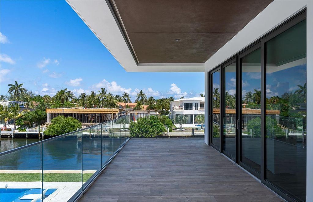 This Mansion in Golden Beach is a modern tropical oasis is situated on a wide canal with breathtaking water views available for sale. This home located at 660 N Island, Golden Beach, Florida