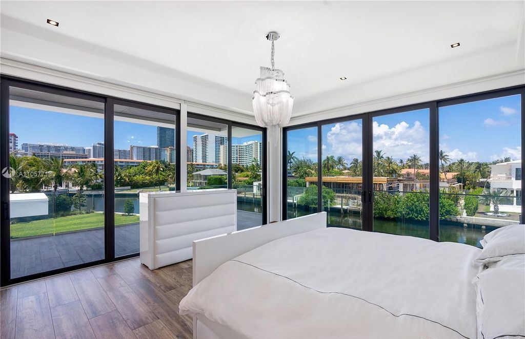 This Mansion in Golden Beach is a modern tropical oasis is situated on a wide canal with breathtaking water views available for sale. This home located at 660 N Island, Golden Beach, Florida